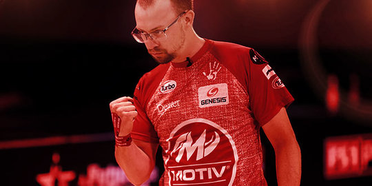 Professional bowler celebrating a good shot in red filter