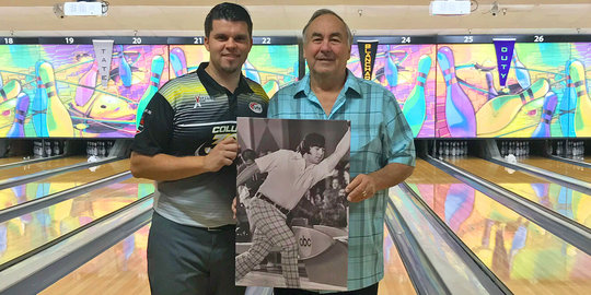 Josh and Gary smile infront of lanes