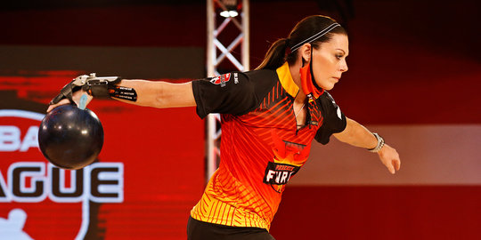 woman throwing a bowling ball