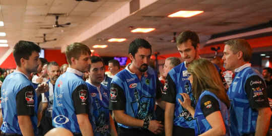 The 3-1 New Jersey KingPins listen to their co-manager Carolyn Dorin-Ballard